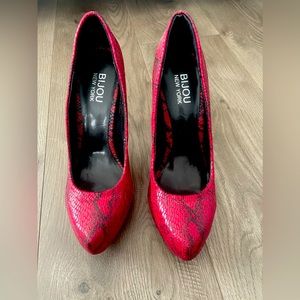 Fun red snakeskin heel. Size 8.5
